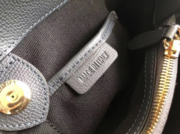 B**rry the medium banner in leather and house check