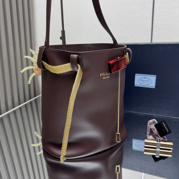 Pra*a buckle leather bucket bag with jeweled belt