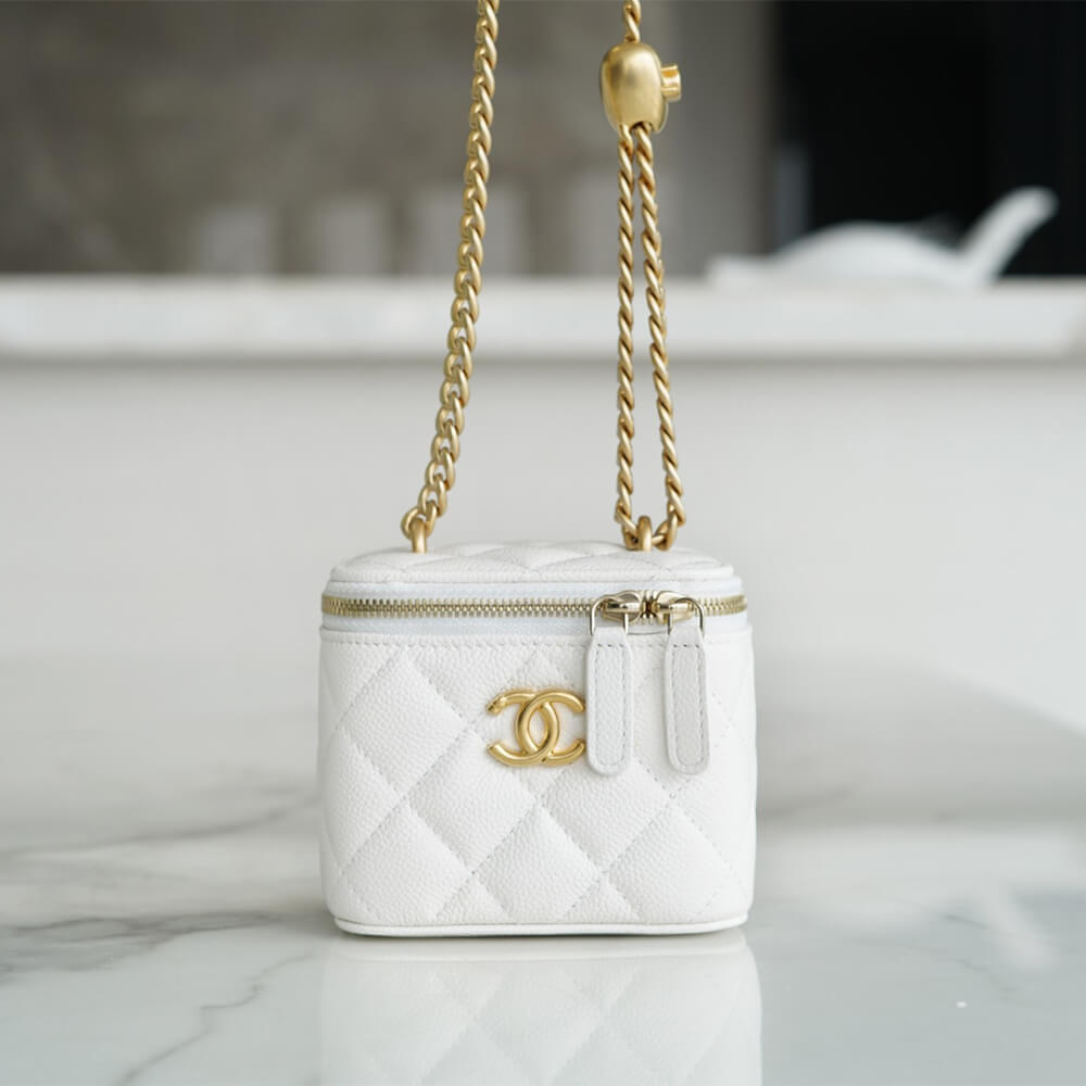 Ch*el small gold ball makeup bag