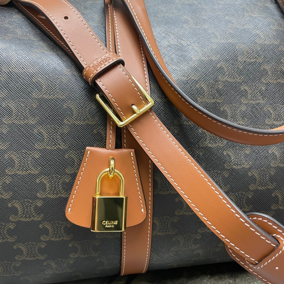 Ce**e medium duffle bag in logo-print calfskin