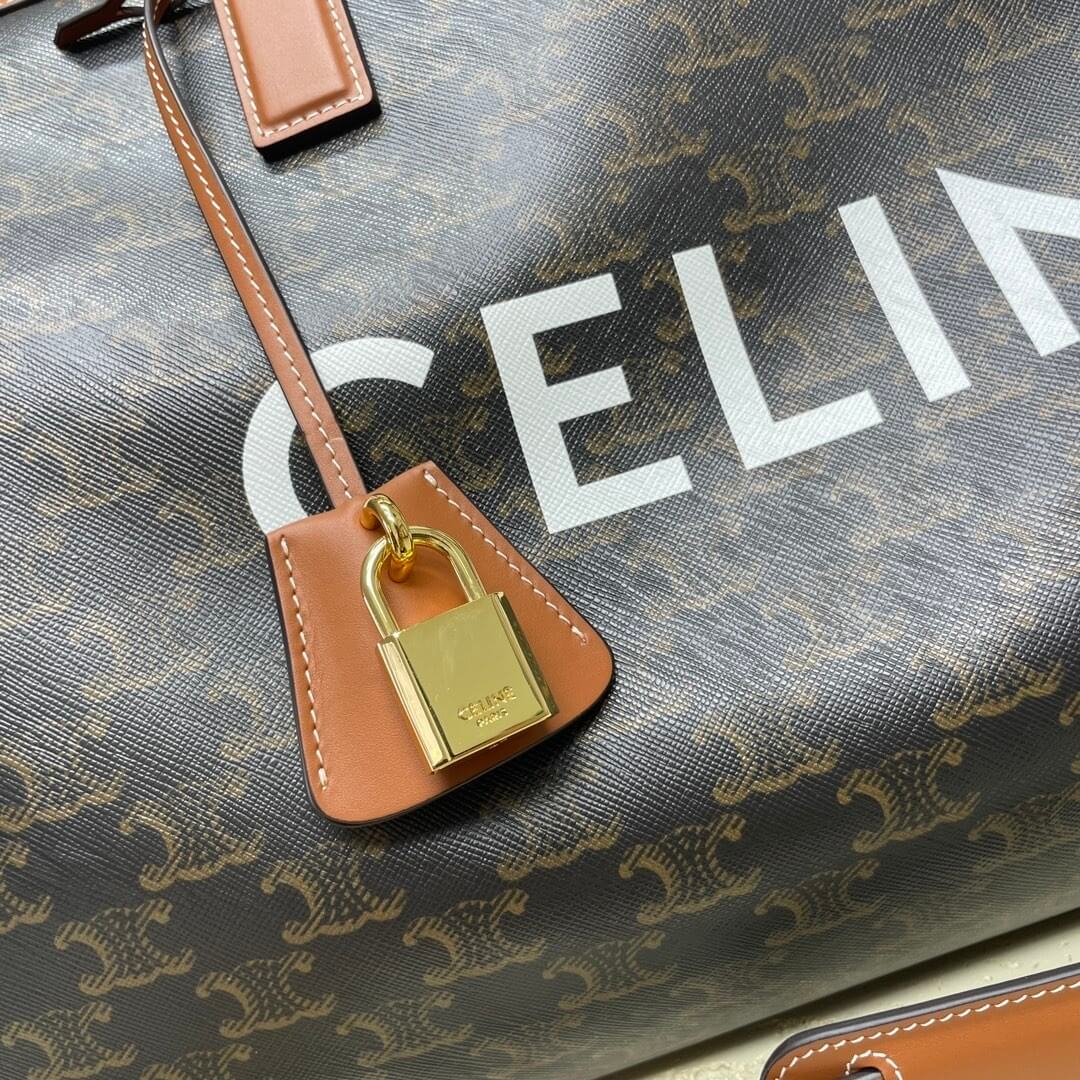 Ce**e medium duffle bag in logo-print calfskin